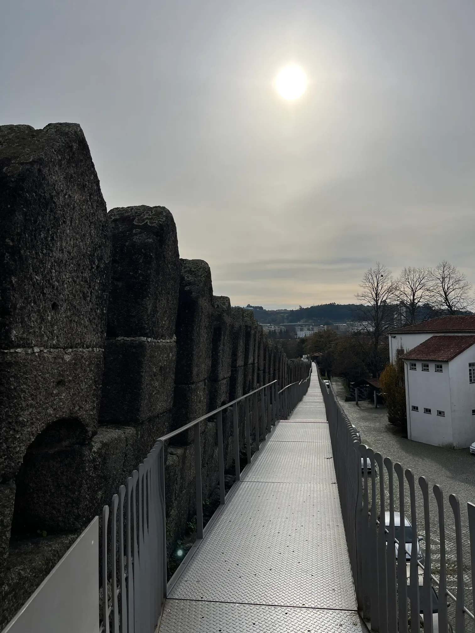 Guimarães defensive walls with metal walkway for visitors