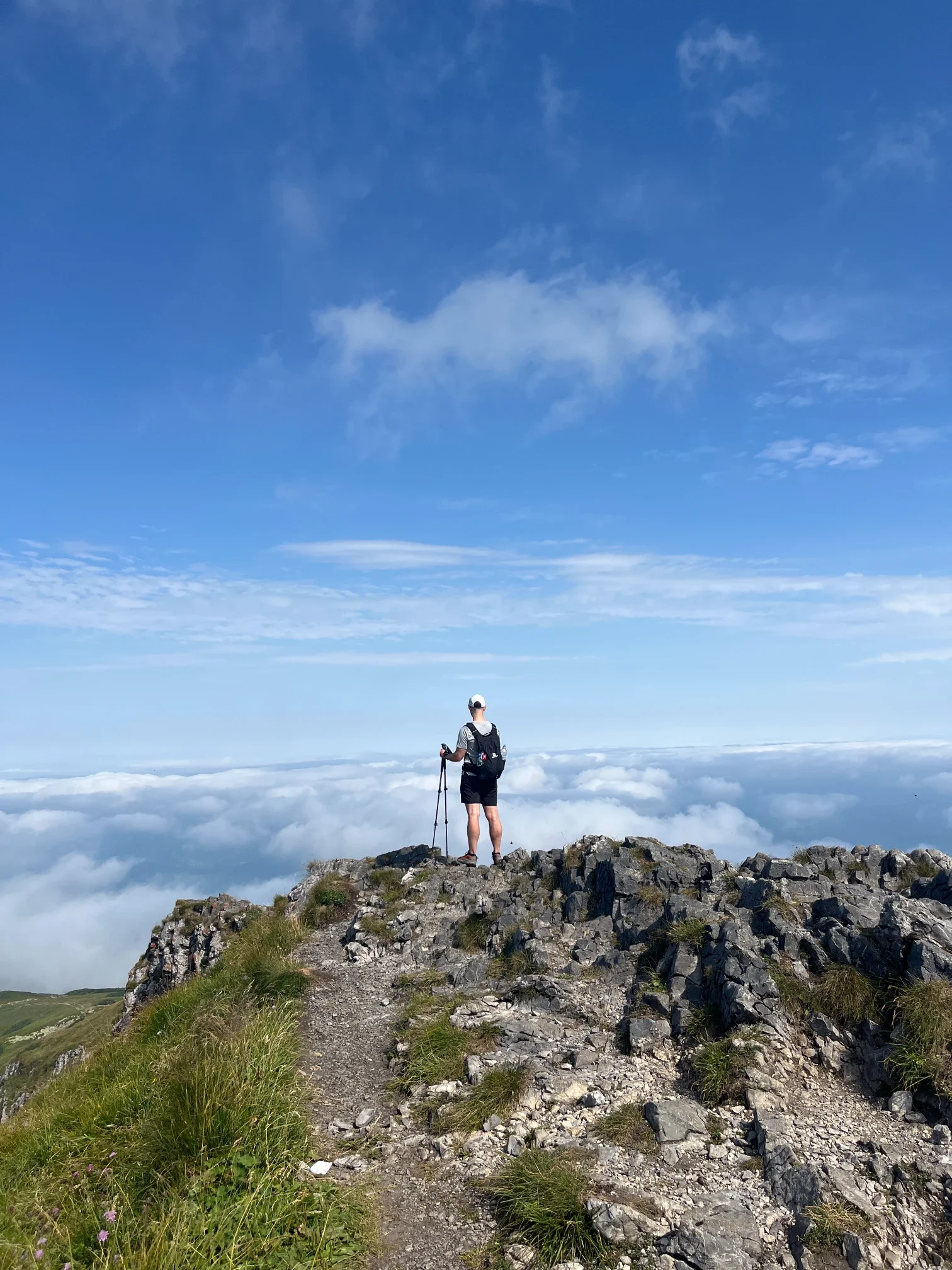 A hiker at the summit of Veľký Kriváň in Malá Fatra
